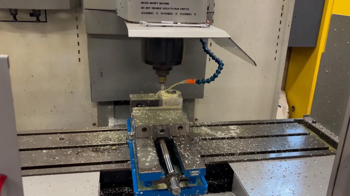 CNC machine milling a metal component